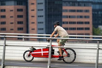 Cyclists on the Bryggebroen cycle and footpath bridge over the harbour, Sydhavnen, Copenhagen is