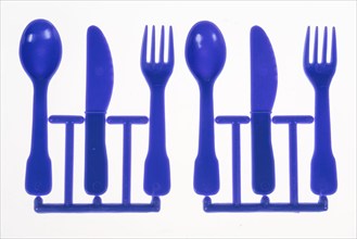 Plastic cutlery, spoon, knife, fork, still on the cast strand, children's cutlery