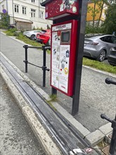 The world's only bicycle lift on a steep street with parked cars and pavement, Nidarelva,