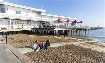 Sandy beach and pier on seafront, Felixstowe, Suffolk, England, UK