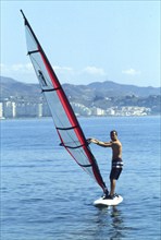 Windsurfer on calm water in Calella, Costa Brava, Barselona, ??Catalonia, Spain, Southern Europe.