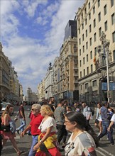 Pedestrians crossing busy road of Gran Via, Madrid city centre, Spain, Europe