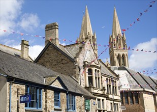 Spires of cathedral rise above historic town centre buildings, Truro, Cornwall, England, UK