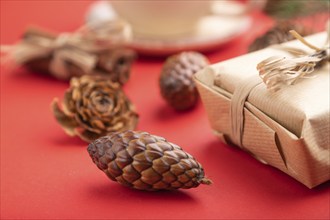 Christmas or New Year composition. Decorations, box, cinnamon, cones, fir and spruce branches, cup