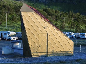 Golden restroom and lavatory at beach Ersfjordstranden, fjord Ersfjord, public recreation area,