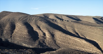 Mountains with structures and layers near Agdz, Morocco, Africa