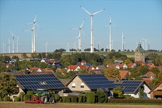 Wind farm above the village of Lichtenau, self-proclaimed energy town, houses with photovoltaic