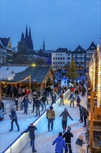 Ice rink at the Christmas market on the Heumarkt in the old town of Cologne, Cologne Cathedral,