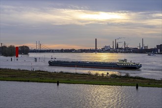 High water on the Rhine near Duisburg, freighter enters the harbour canal, Neuenkamp Rhine bridge,