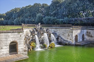 Fountain sculptures at the water basins in the garden of the royal palace Palazzo Reale, Italian