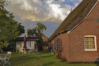 Europe, Germany, Lower Saxony, Summer motif, Evening mood, Garden and thatched roof house, Europe