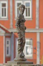 Sculpture Fortitudo by Bernd Göbel 2021 with blurred Old Town Hall, allegory, Greek mythology,