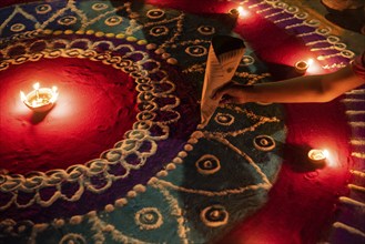 Students of Cotton University lighting making a rangoli on the occasion of Diwali Festival, on