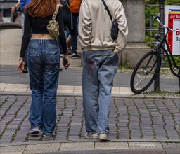 Young couple in jeans, Berlin, Germany, Europe