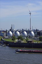 Europe, Germany, Hamburg, Köhlbrandhöft sewage treatment plant, view of the digestion towers, Elbe