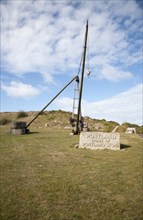 Antique crane forming monument to the quarrying heritage as the Home of Portland Stone, Isle of