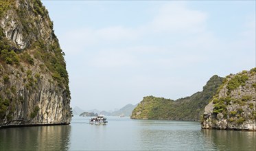 Excursion boats and the karst rocks in Lan Ha Bay, Halong Bay, Vietnam, Asia