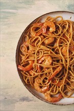 Spaghetti with king shrimps, with spices, top view, selective focus, homemade, no people