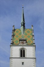 Tower of the Gothic St. Nicholas Church, spire, roof tile, pattern, clock, church tower,