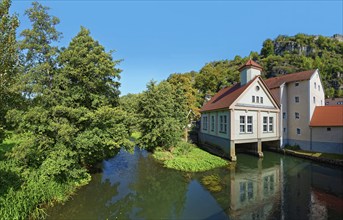 Reflecting Vilsmühle on the idyllic river Vils with surrounding trees, Kallmünz, Upper Palatinate,