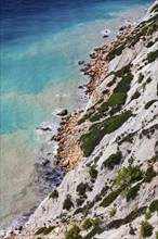 Steep coastline and turquoise-coloured water at Cap Blanc, Ibiza, Balearic Islands, Mediterranean,