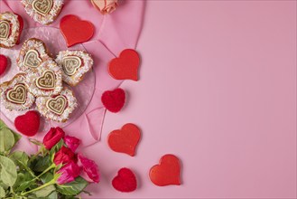 Heart-shaped cupcakes, red hearts and roses, Valentine's Day, pink background