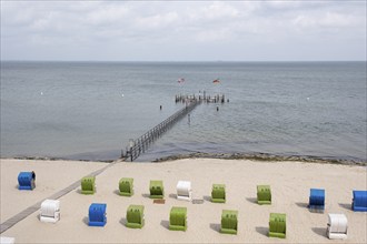 Flooded jetty, beach chairs on sandy beach, North Sea coast, Wyk, Föhr, North Sea island, North