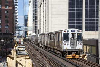 Chicago L Elevated elevated metro train public transport train at the Harold Washington Library