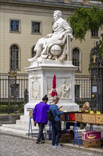 Tourists at the flea market stall in front of Humboldt University, Unter den Linden, Berlin,