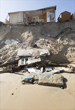 March 2018, Clifftop property collapsing due to coastal erosion after recent storm force winds,