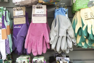 Gardening gloves display inside The Walled garden plant nursery, Benhall, Suffolk, England, UK