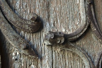 Orcival. Intricate Roman wrought iron hinge displayed at the Basilica Notre-Dame d'Orcival, Puy de