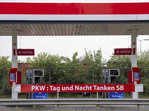 Self-service petrol station for cars, open 24 hours a day, around the clock, on the border between