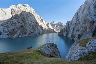 Hiker in front of Kol Suu Mountain Lake, Kol Suu Lake, Sary Beles Mountains, Naryn Province,