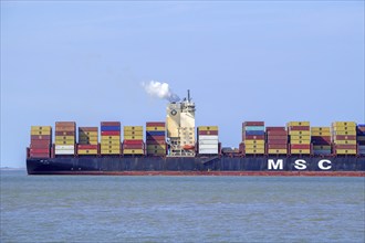 Swiss MSC container ship, containership of the Mediterranean Shipping Company S. A. loaded with