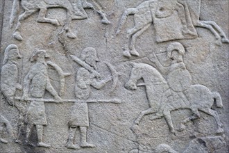 Detail of battle scene on the rear of the Aberlemno Kirkyard Cross Slab, a Pictish stone in