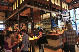 Customers inside Mercado de San Miguel market, Madrid city centre, Spain, Europe