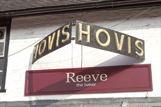 Old fashioned traditional Hovis bread sign above Reeve bakery shop, Amesbury, Wiltshire, England,