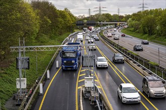 Weighing and barrier system on the A42 motorway, in front of the dilapidated motorway bridge over