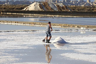 Workers in the salt pans of Trapani, Sicily, Italy, Europe