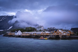 The village of Sakrisoy with its typical yellow or ochre-coloured wooden houses on wooden stilts