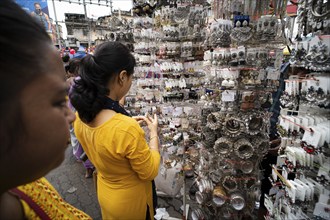 Women buys jewelleries at street market ahead of Durga Puja festival on October 7, 2024 in