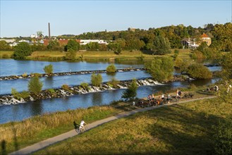 The Ruhr weir, barrage of the Ruhr near Hattingen, cyclist, on the Ruhr Valley cycle path, behind