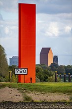 The sculpture Rhine Orange at the mouth of the Ruhr into the Rhine, skyline of the city centre of