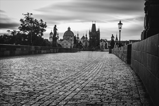 Charles Bridge with Old Town Bridge Tower, morning mood, black and white, Prague, Czech Republic,