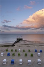 Pier and beach chairs on the North Sea coast, evening light, Wyk, Föhr, North Sea island, North