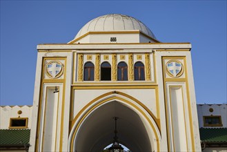 Market hall, Nea Agora, close-up of a historic building with dome, central windows and coat of