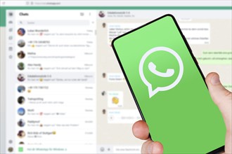 WhatsApp logo messenger app on a mobile phone smartphone and computer in Stuttgart, Germany, Europe