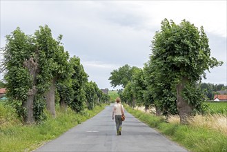 Avenue, street, trees, elderly woman, Burgstemmen, Lower Saxony, Germany, Europe