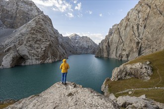 Hiker in front of Kol Suu Mountain Lake, Kol Suu Lake, Sary Beles Mountains, Naryn Province,